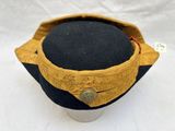 an image of a hat with a button on it
