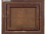 an old wooden frame with a label on it