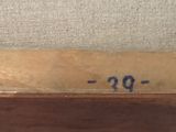 an image of a close up of a painting on a wooden frame