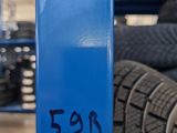 a blue pole with a number on it in a warehouse