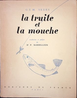 an old book with a drawing of a fish on it ' s cover