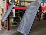 a large metal ramp in the middle of a garage