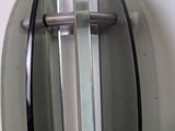 a close up of a glass door handle on a wall