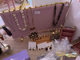 a table that has a purse, a purse, and other items on it