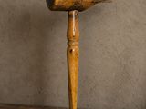 a wooden object that is on a wooden table