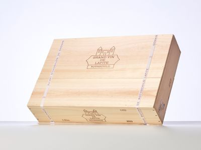 a wooden box with a logo on it sitting on a table