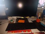an image of a computer desk with a keyboard and monitor