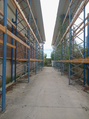 an image of a walkway with scaffolding in a warehouse