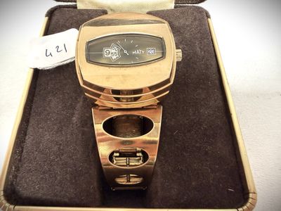 a watch that is sitting in a case on a table