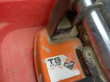 a tool that is sitting on top of a red box