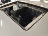 a car with a window that is open in a garage