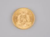 a gold coin with a picture of an eagle on it