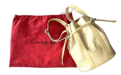 a close up of a purse and a red bag on a white surface