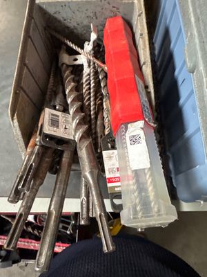 a box full of tools that are sitting on the floor