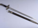 two swords that are laying on a white surface