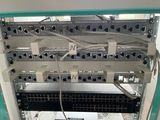a rack of wires and switches in a room