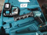 a blue tool box with a cordless drill and a charger in it