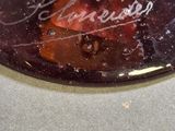 a close up of a bowl with a fruit inside of it