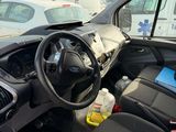 the interior of a car with a bunch of items in the passenger seat