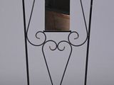 a mirror on a stand with a mirror in it