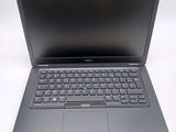 a laptop computer with a keyboard on a white surface
