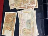 a lot of money in a binder on a table