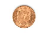 l'image d'une pièce d'or sur laquelle figure une tête de femme