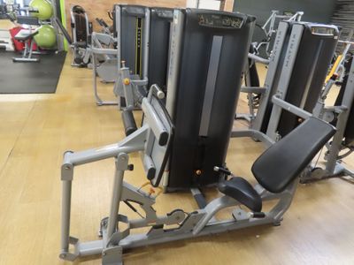 a row of exercise equipment in a gym room