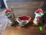 three vases that are sitting on a table