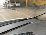 a remote control on the dashboard of a car in a parking garage
