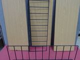 three black wire baskets on a pink table with a pink table cloth