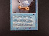 a card that has a picture of a person holding a sword