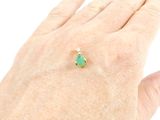 an image of a woman ' s hand with a ring on it