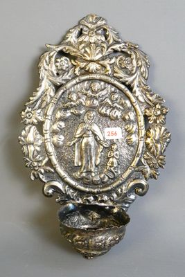 a silver plate with a picture of a man and a woman on it