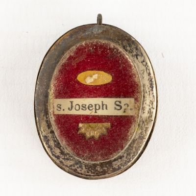 a close up of a badge with a name on it
