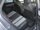 the back seats of a car with a seat belt in the back of it