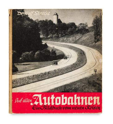 an old book with a picture of a car driving down a road