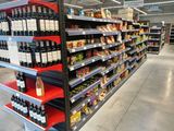 many bottles of wine on the shelves in the store