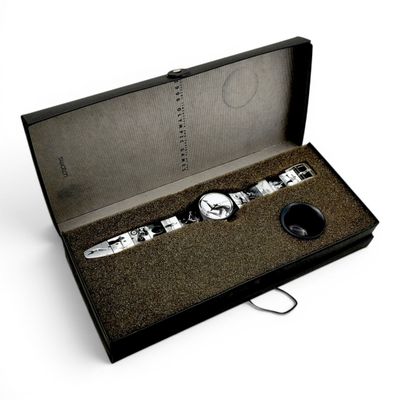 a black box with a watch and a keychain in it