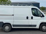 a white van that is parked in a parking lot