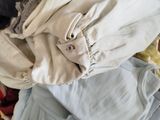 a box full of clothes that is sitting on the floor