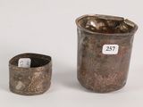an image of a silver cup and a silver cup on a white surface