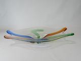 a glass bowl that has three different colors on it
