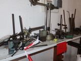 a picture of a cluttered workbench with tools on it