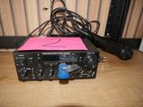 a microphone sitting on a table next to a radio