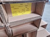 a stack of cardboard boxes with a price tag on them