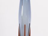 an image of a tall blue glass lamp on a wooden stand