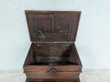 a small wooden box with a handle on top of it