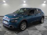 the blue citrole is parked in the garage on a checkered floor
