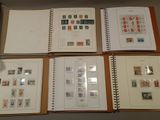 many different types of stamps on the pages of a book